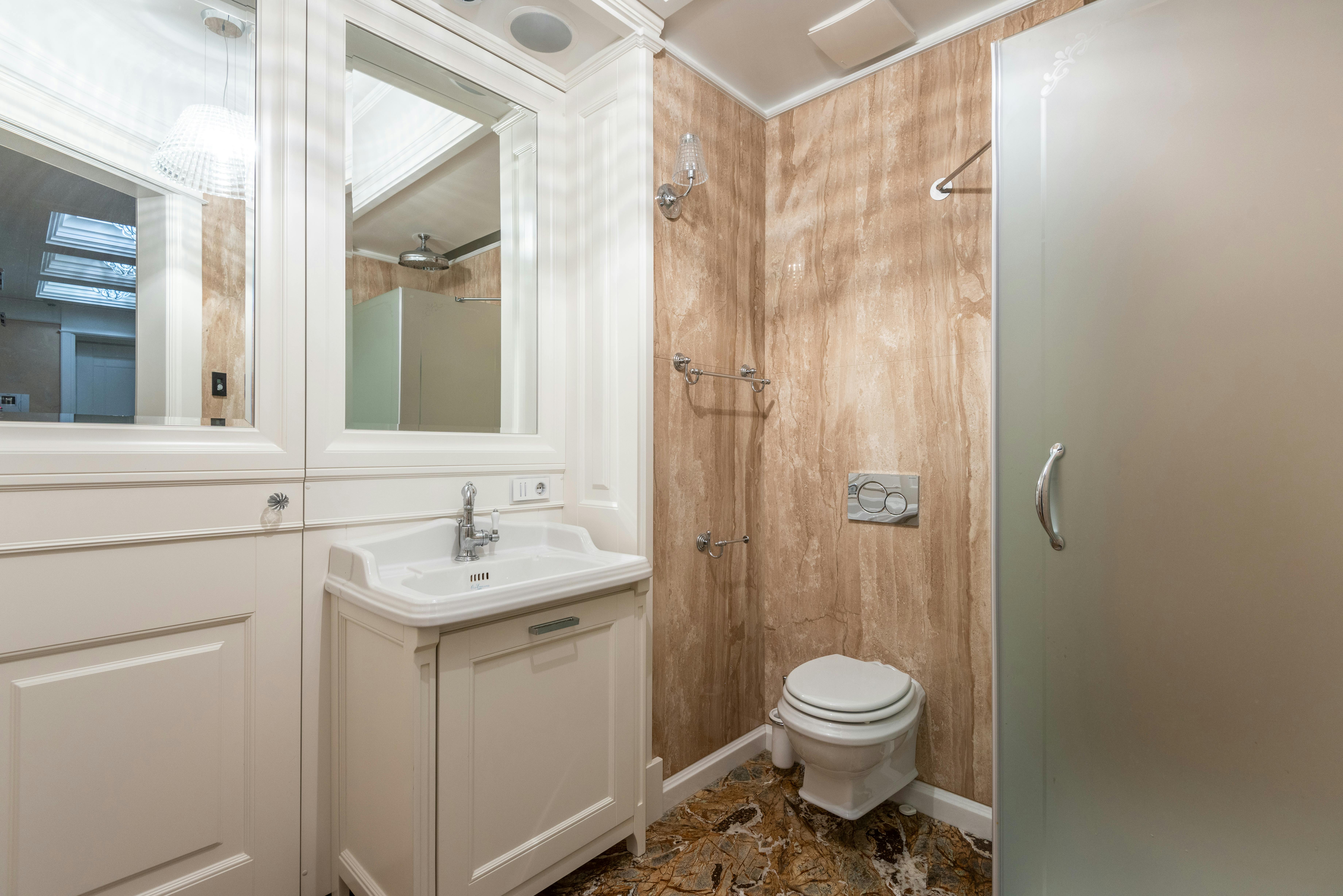 Bright bathroom with mirrors and soft colors