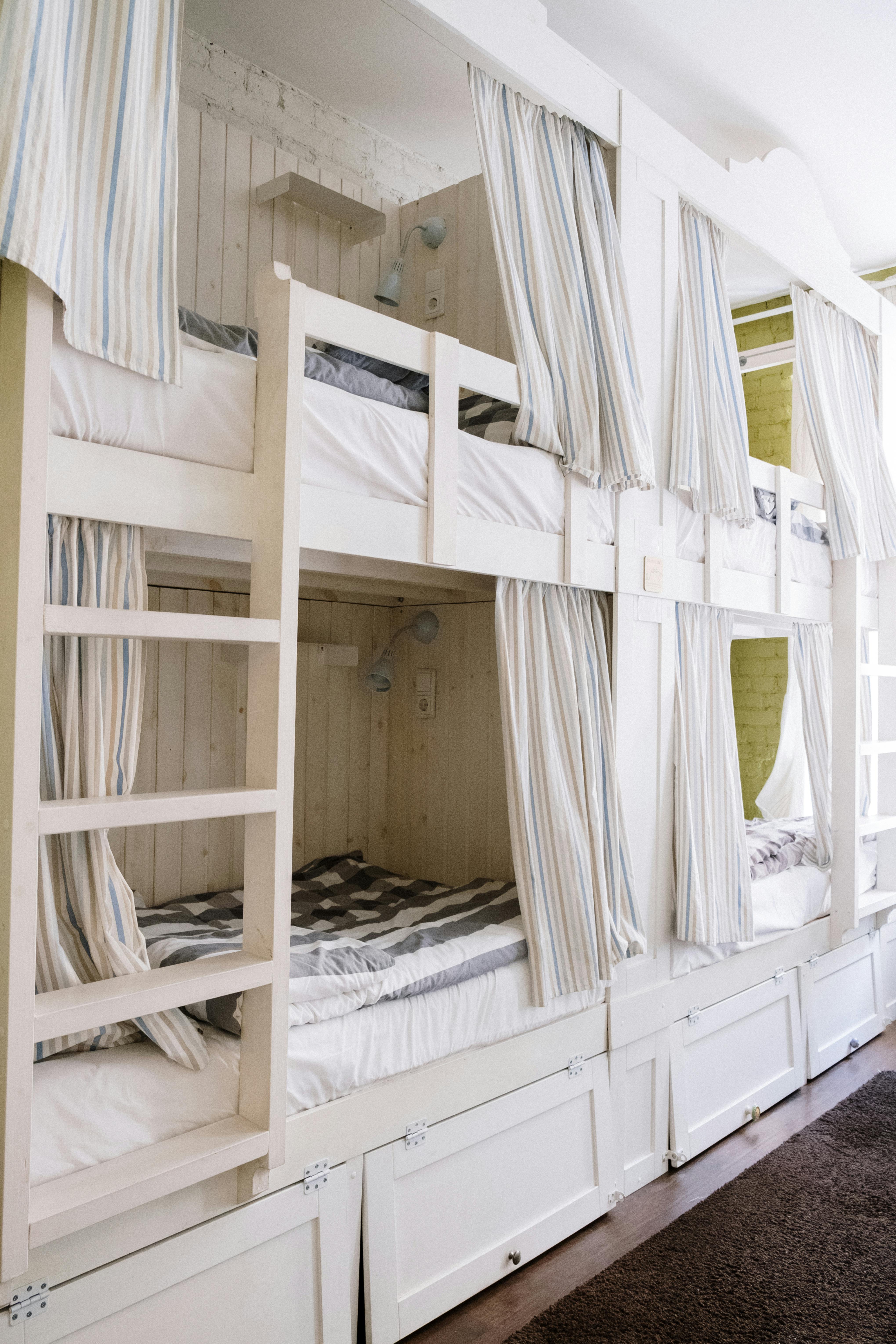 Small bedroom with storage bed and neutral decor