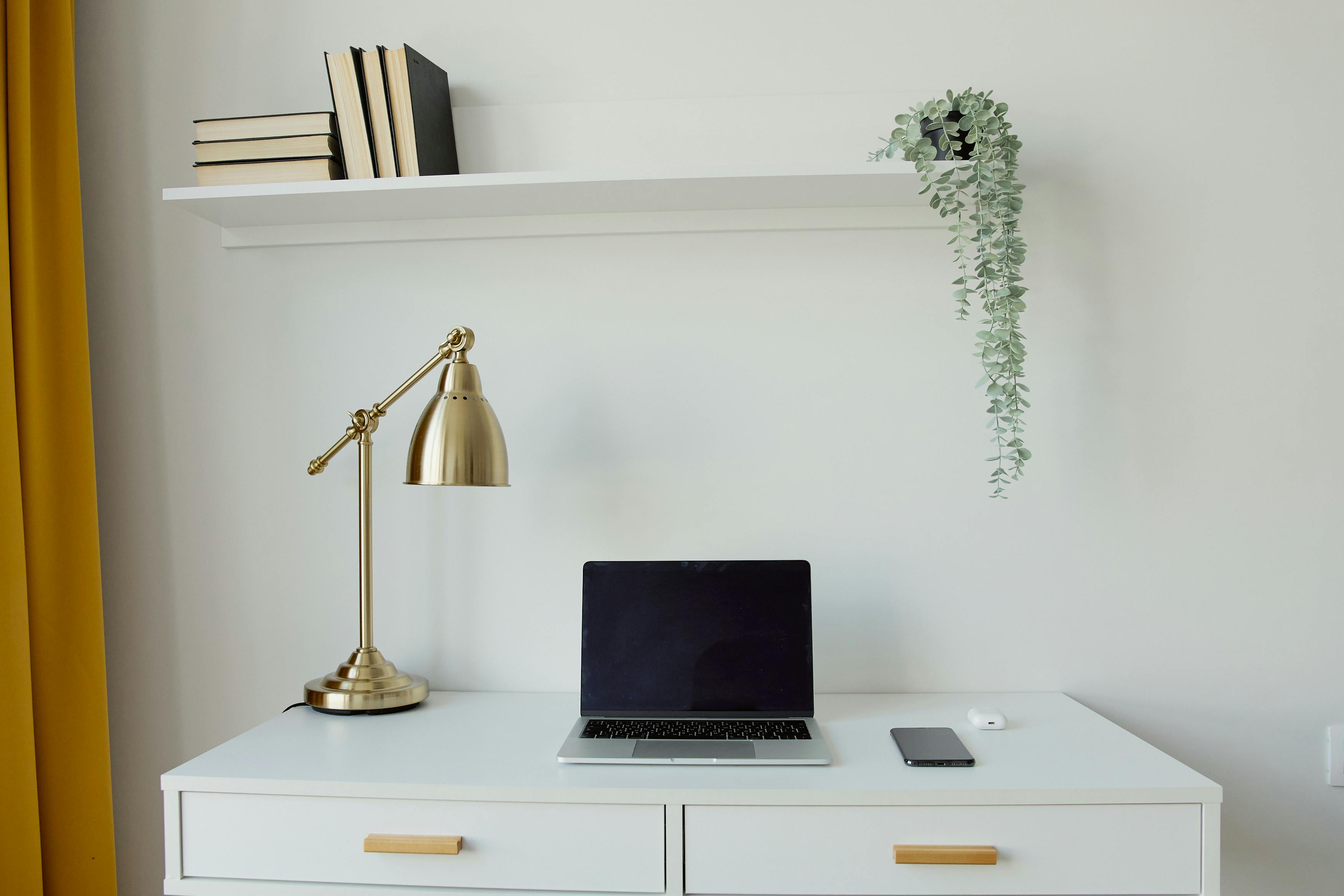 Floating shelves and wall-mounted cabinet in small lounge