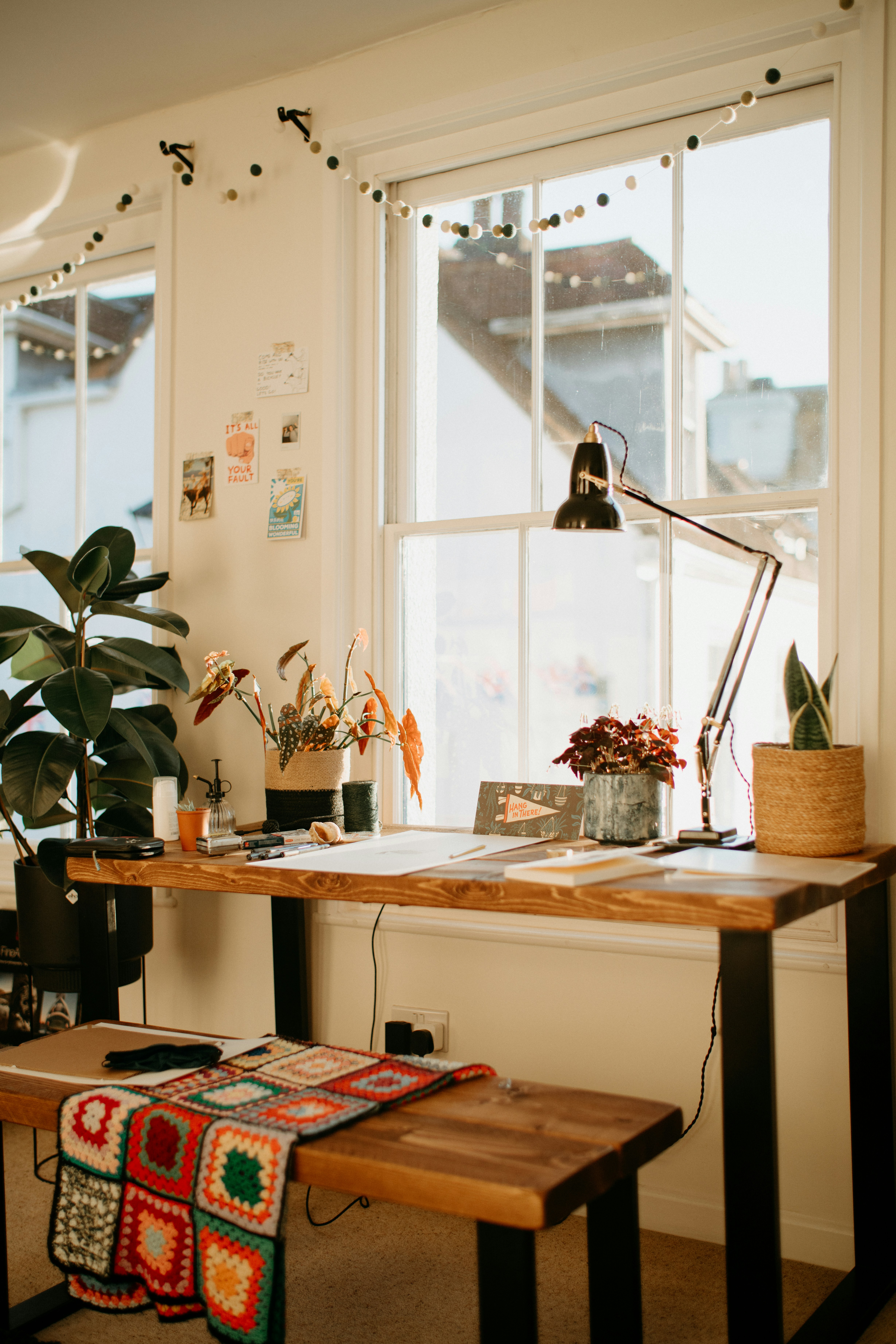 Organized workspace with plants and laptop